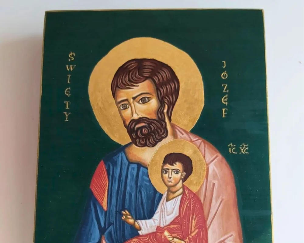 Hand-painted icon of Saint Joseph holding the Christ Child with genuine gold leaf halo.